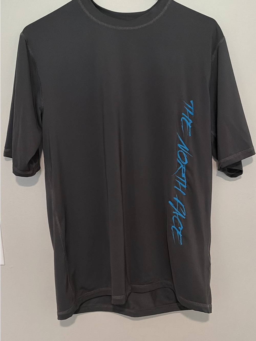The North Face Men’s Short-Sleeve Tee in Charcoal with Blue Script